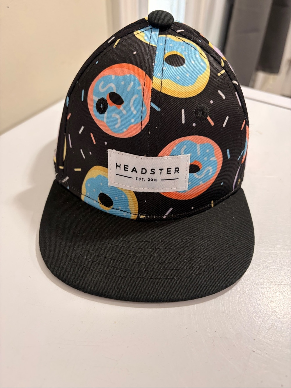 Kids Black Snapback Hat with Blue & Peach Donut Print